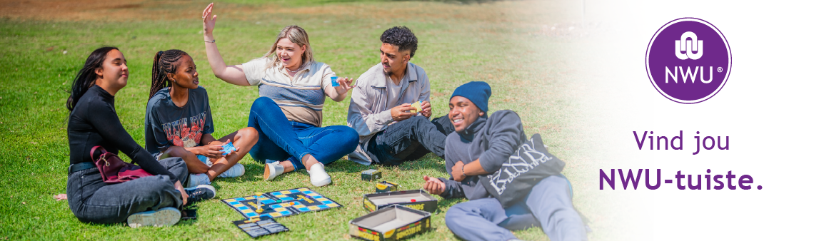 NWU university students outside a residence on the grass