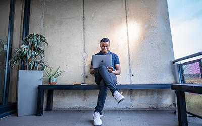 Postgraduate student working on his laptop